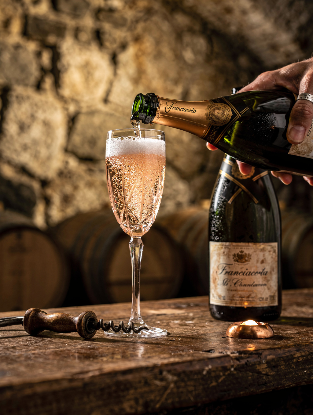 Chilled Franciacorta sparkling wine pouring into flute glass